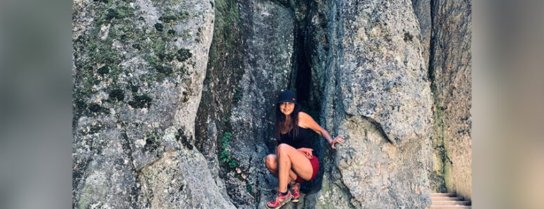 Image of employee Lisa hiking in the mountains