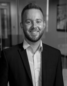 lance dohnal headshot smiling in boardroom director of ftl sales agent division